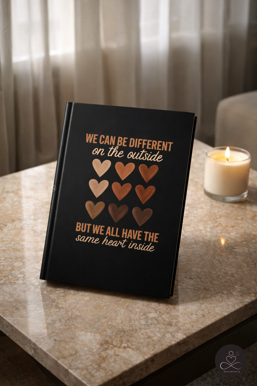 We can be different on the outside but we all have the same heart inside journal on table with aromatherapy candle andrea callahan